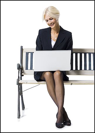 simsearch:640-02771838,k - Businesswoman sitting on bench with laptop Stock Photo - Premium Royalty-Free, Code: 640-02770077