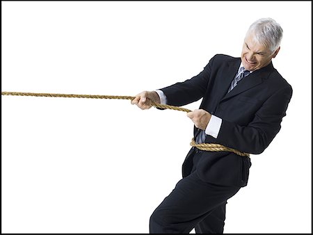 simsearch:640-01360534,k - Businessman in a tug of war Foto de stock - Royalty Free Premium, Número: 640-02770088