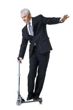 Businessman on a scooter Stock Photo - Premium Royalty-Free, Code: 640-02770112