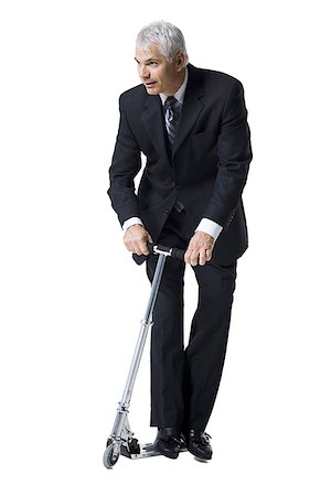 Businessman on a scooter Stock Photo - Premium Royalty-Free, Code: 640-02770113