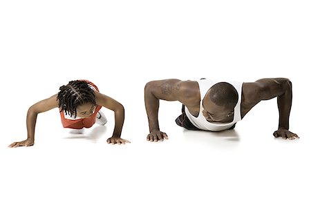 simsearch:640-02770204,k - Father and son doing push ups Foto de stock - Royalty Free Premium, Número: 640-02770221