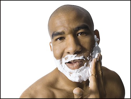 espuma de afeitar - Man with shaving lotion on face Foto de stock - Sin royalties Premium, Código: 640-02770414