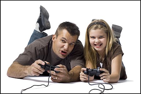 simsearch:640-02769084,k - Father and daughter playing a video game Stock Photo - Premium Royalty-Free, Code: 640-02770455