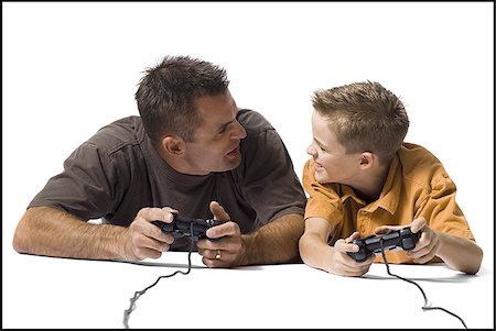 simsearch:640-02770204,k - Father and son playing a video game Stock Photo - Premium Royalty-Free, Code: 640-02770452