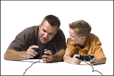 simsearch:640-02770204,k - Father and son playing a video game Foto de stock - Royalty Free Premium, Número: 640-02770453