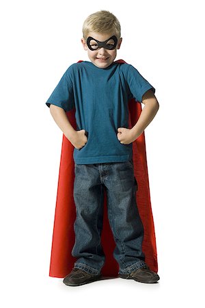 Young boy in superhero costume Stock Photo - Premium Royalty-Free, Code: 640-02770471