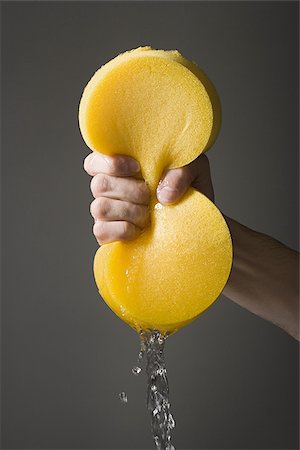 sponge and water - Hand wringing a sponge Stock Photo - Premium Royalty-Free, Code: 640-02770536