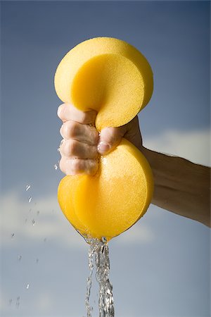 sponge and water - Hand wringing a sponge Stock Photo - Premium Royalty-Free, Code: 640-02770539