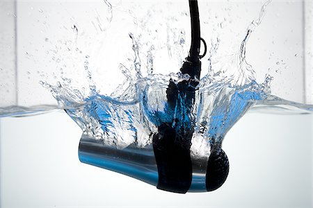 dropped in water nobody - Hair dryer dropped in water Stock Photo - Premium Royalty-Free, Code: 640-02770540