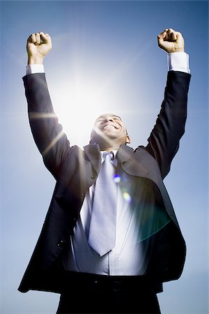 Businessman pumping fists in the air Stock Photo - Premium Royalty-Free, Code: 640-02770571