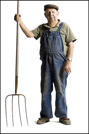 Farmer holding a pitchfork Stock Photo - Premium Royalty-Free, Code: 640-02770614