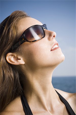 sunglasses on head - Woman wearing sunglasses Stock Photo - Premium Royalty-Free, Code: 640-02770709