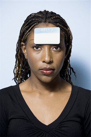 Woman with name tag on forehead Foto de stock - Sin royalties Premium, Código: 640-02770984