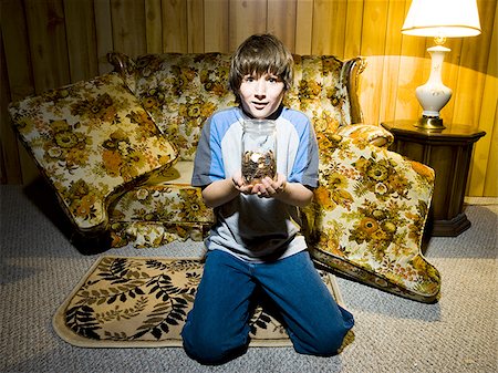 simsearch:640-02771097,k - Boy with coin jar smiling Stock Photo - Premium Royalty-Free, Code: 640-02771100