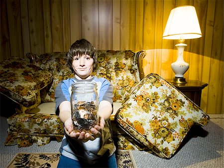 simsearch:640-02771097,k - Boy with coin jar smiling Stock Photo - Premium Royalty-Free, Code: 640-02771101