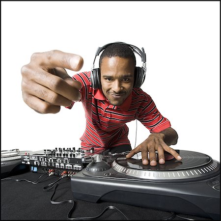 dj white background - DJ with headphones spinning records Stock Photo - Premium Royalty-Free, Code: 640-02771116