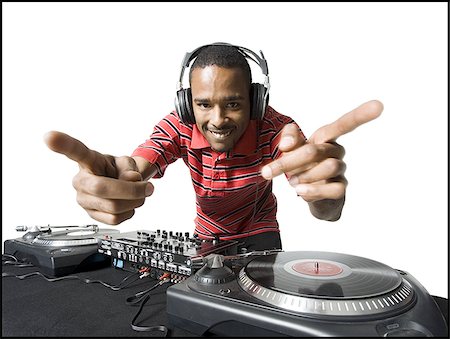 disc jockey - DJ with headphones spinning records Foto de stock - Sin royalties Premium, Código: 640-02771118