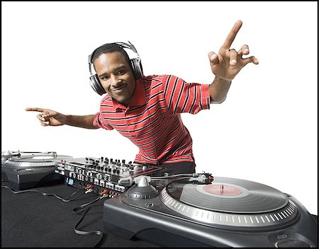 dj - DJ with headphones spinning records Fotografie stock - Premium Royalty-Free, Codice: 640-02771119