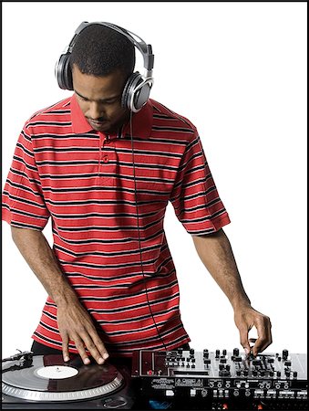 disc jockey - DJ with headphones spinning records Foto de stock - Sin royalties Premium, Código: 640-02771111