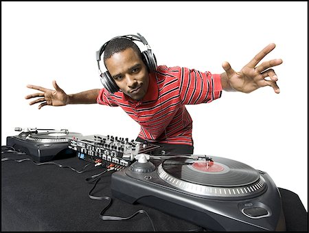 song white background - DJ with headphones spinning records Stock Photo - Premium Royalty-Free, Code: 640-02771120