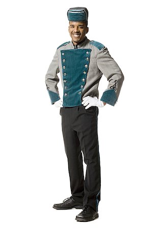 Bellboy smiling full length Foto de stock - Sin royalties Premium, Código: 640-02771141