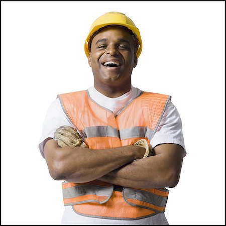Male road worker with crossed arms and hardhat Stock Photo - Premium Royalty-Free, Code: 640-02771167