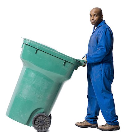 Garbage man with recycling bin Stock Photo - Premium Royalty-Free, Code: 640-02771191