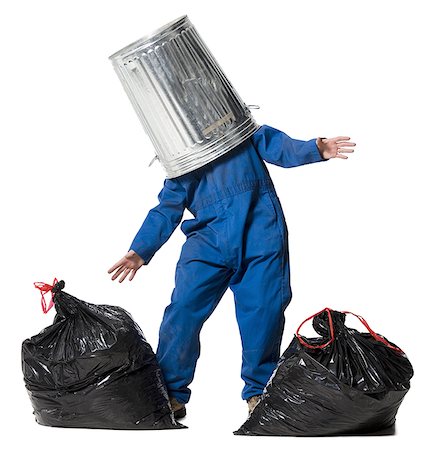 Garbage man with trash can on head Stock Photo - Premium Royalty-Free, Code: 640-02771201