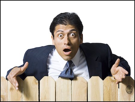 simsearch:640-02771261,k - Businessman looking over wooden fence Stock Photo - Premium Royalty-Free, Code: 640-02771244