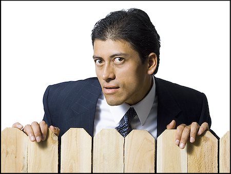 simsearch:640-02771261,k - Businessman looking over wooden fence Stock Photo - Premium Royalty-Free, Code: 640-02771243