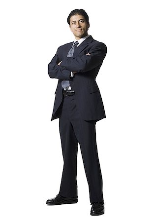 Businessman posing with crossed arms Stock Photo - Premium Royalty-Free, Code: 640-02771251