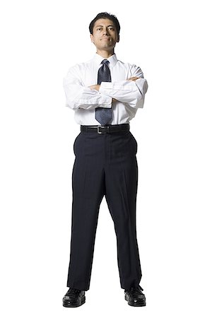 silhouette of businessman standing in office - Businessman smiling Stock Photo - Premium Royalty-Free, Code: 640-02771252