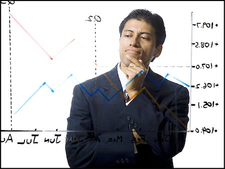 simsearch:640-02771261,k - Businessman calculating earnings Stock Photo - Premium Royalty-Free, Code: 640-02771265