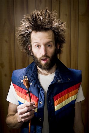 shocked hairs - Man after electric shock with electric plug and smoke Stock Photo - Premium Royalty-Free, Code: 640-02771289