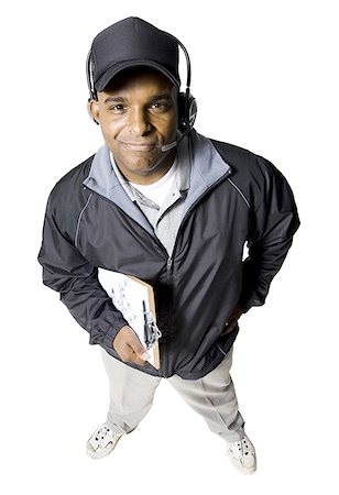 Coach with cap and whistle smiling Stock Photo - Premium Royalty-Free, Code: 640-02771299