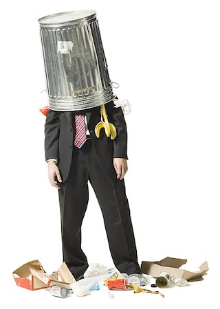 silhouette of businessman standing in office - Businessman with trash can on head Stock Photo - Premium Royalty-Free, Code: 640-02771290
