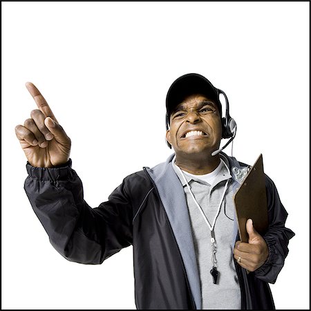 Coach shouting and pointing Stock Photo - Premium Royalty-Free, Code: 640-02771307