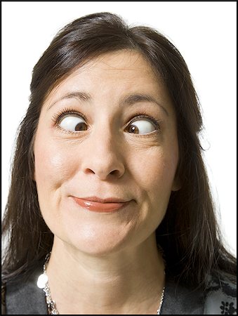 simsearch:640-02773811,k - Closeup of woman with crossed eyes making funny face Stock Photo - Premium Royalty-Free, Code: 640-02771385