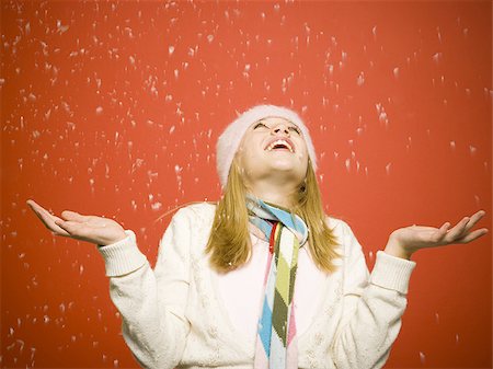 red scarf woman - Girl looking up at snow Stock Photo - Premium Royalty-Free, Code: 640-02771419