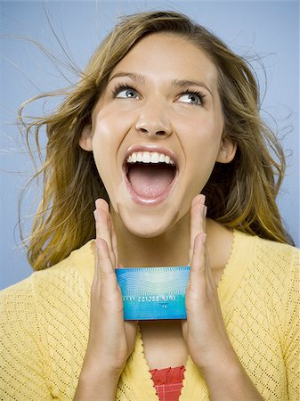 face card - Excited woman with credit card Foto de stock - Sin royalties Premium, Código: 640-02771447