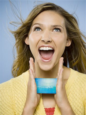 face card - Excited woman with credit card Stock Photo - Premium Royalty-Free, Code: 640-02771448