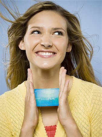 face card - Excited woman with credit card Stock Photo - Premium Royalty-Free, Code: 640-02771449