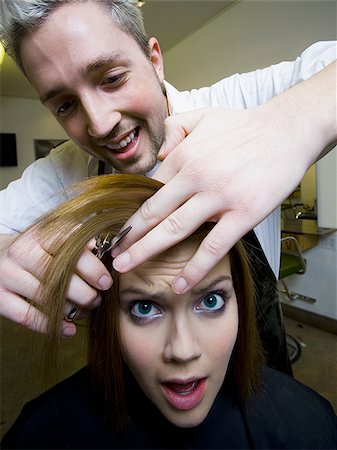 Woman having hair cut by hairdresser Foto de stock - Sin royalties Premium, Código: 640-02771527