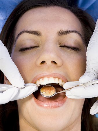 simsearch:640-02771776,k - Woman having dental examination Foto de stock - Royalty Free Premium, Número: 640-02771579
