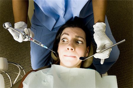 simsearch:640-02771743,k - Woman having dental examination Foto de stock - Sin royalties Premium, Código: 640-02771584