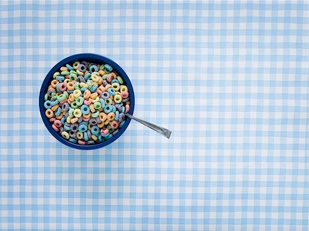 Bowl of cereal with spoon Stock Photo - Premium Royalty-Free, Code: 640-02771599