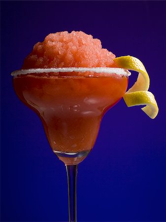 simsearch:614-00397185,k - Red slush beverage in cocktail glass with lemon garnish Stock Photo - Premium Royalty-Free, Code: 640-02771632