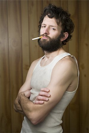 simsearch:640-01363403,k - Man standing with cigarette and crossed arms Stock Photo - Premium Royalty-Free, Code: 640-02771717