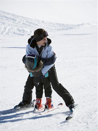 ski goggles mature not senior - Woman and young girl skiing Stock Photo - Premium Royalty-Free, Code: 640-02772022