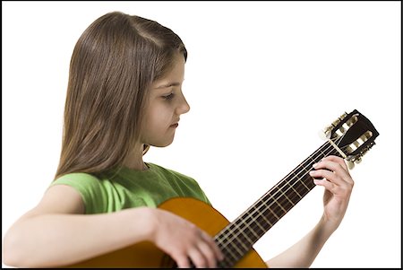 simsearch:640-02774467,k - Girl with braces playing guitar smiling Stock Photo - Premium Royalty-Free, Code: 640-02772213